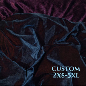 A close up of the two velvets, on which is almost black with a turquoise and red sheen depending on which way the light hits it, the other is an Amythyst purple colour with a gem-like texture.